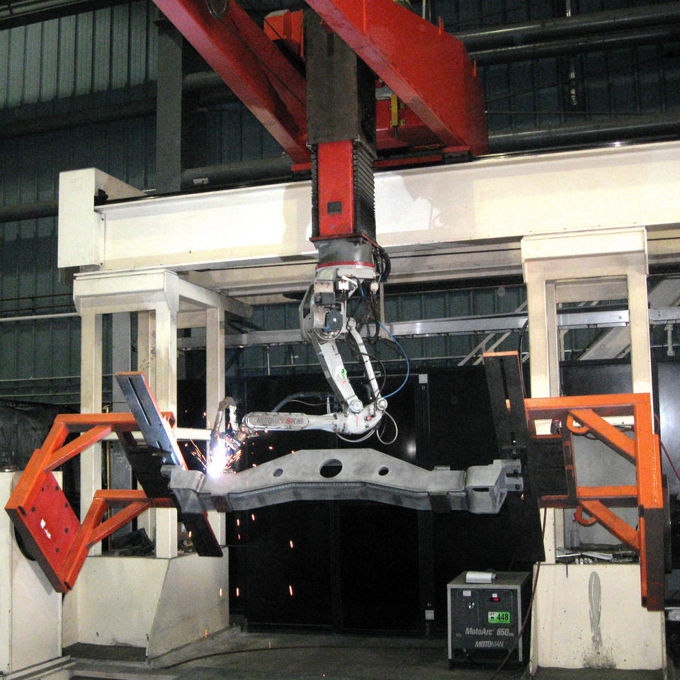 Steering beam being welded by large welding robot at Piper Lane location. This photo demonstrates some of ADJ Industries' welding capabilities.