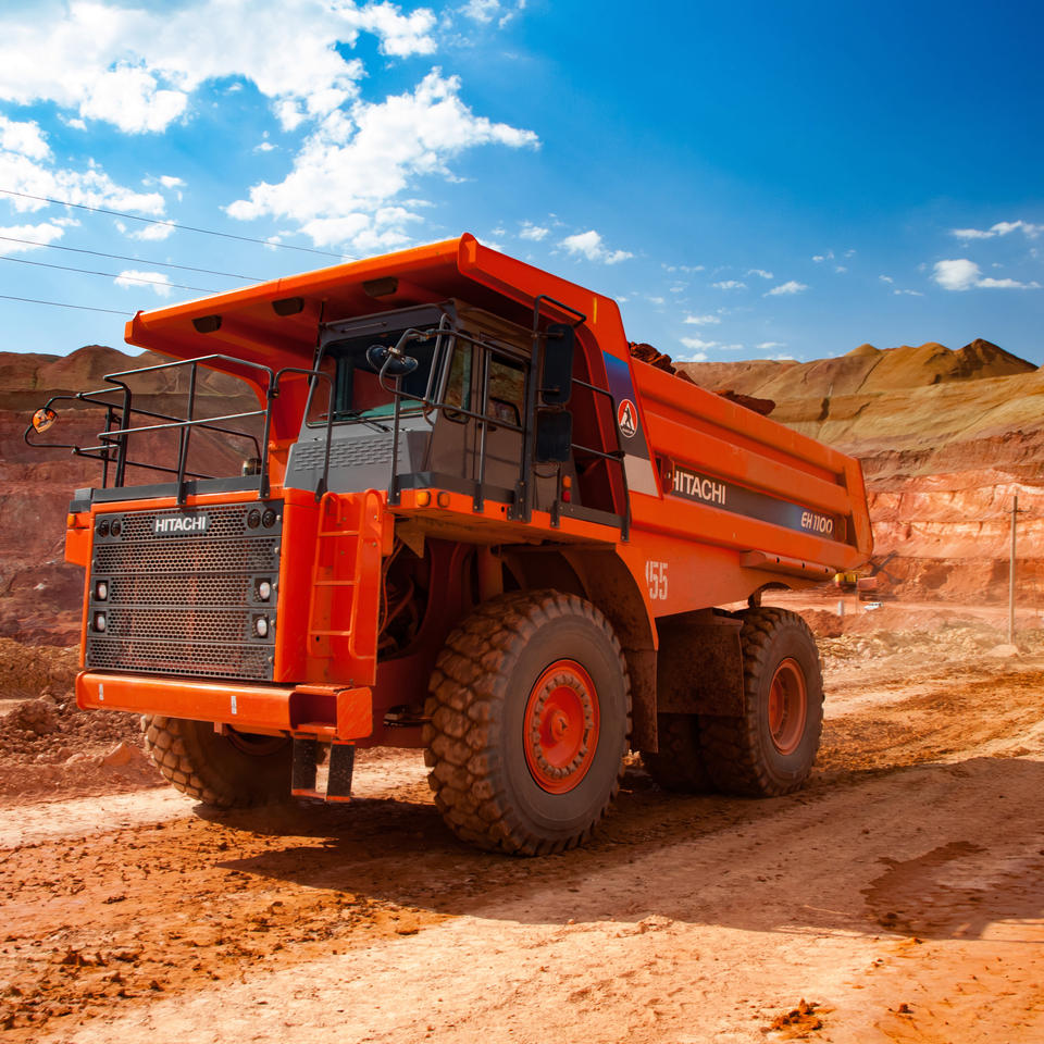 Mining vehicle in a quarry setting. Mining industry stock image licensed to ADJ Industries Inc.